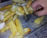 Foto del paso 12 de la receta: Papas al horno PASADAS POR HARINA