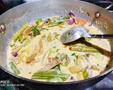A picture of step 4 of Avial curry with rice.