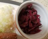 A picture of step 4 of Corned Beef Hash with a fried egg on top.