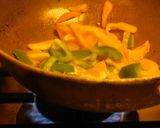 A picture of step 4 of Pasta sizzler sizzling with hot chilli powder, veggies, cheese.