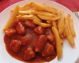 Foto del paso 5 de la receta Pollo con tomate y patatas fritas