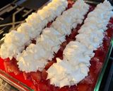 A picture of step 10 of Strawberry jello poke cake.