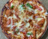 A picture of step 7 of Simple Chicken Tikka Pizza.