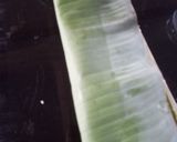 A picture of step 5 of Ila adda banana leaf appam.