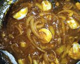 A picture of step 3 of Alkubus with onion sauce.