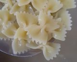 A picture of step 1 of Farfalle Pasta with cheese & Schezwan sauce.