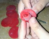 A picture of step 8 of Valentines day special fondant red rose cake topper.