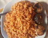 A picture of step 3 of Jollof rice with fried fish.
