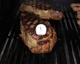 A picture of step 3 of 3 inch thick ribeye steak on BBQ.