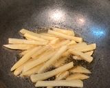 A picture of step 3 of Peri Peri Fries -spicy & crispy.