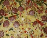 A picture of step 6 of Sauted veggies, sausage mixed in eggs and bakefried.