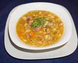 A picture of step 6 of Porotos con Riendas with Smoked Ham.