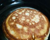 A picture of step 9 of Banana pancakes with chocolate ganache topping.