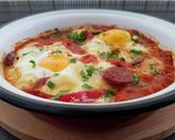 A picture of step 9 of Saganaki with Country Sausage, Eggs, and Graviera Cheese.