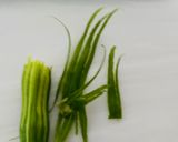 A picture of step 1 of Sharagwani Shing Nu Shaak (Moringa curry).