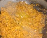 A picture of step 3 of Carrot halwa with walnut topping.