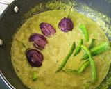 A picture of step 7 of Brinjal and capsicum in green gravy.