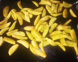 A picture of step 3 of Baked Potatoes wedges.