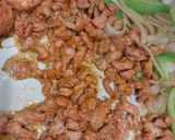 A picture of step 3 of Pork Al pastor with sauteed onions and peppers.