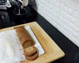A picture of step 11 of Biscuits Meethi (Swiss roll style).