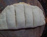 A picture of step 6 of Domino's style stuffed cheese garlic bread.