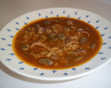 Foto del paso 10 de la receta: Arroz caldoso de calamares y habas