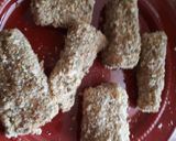 A picture of step 8 of Fish fingers served with French fries.