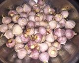 A picture of step 1 of Black Garlic Made with a Rice Cooker.