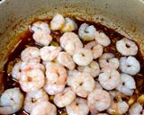 A picture of step 5 of My Chilli, Garlic Prawns in a Sauce with some tempura prawns 🥰.