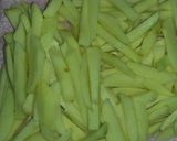 A picture of step 5 of French fries with freid pumpkin leaves (kahurura).