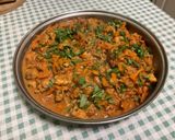Une image de l'étape 28 de Poulet aux cacahuètes, carottes, tomates et épices.
