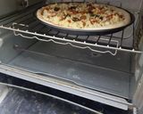 A picture of step 10 of Chicken pizza.