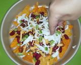 A picture of step 6 of Loaded Cheesy nachos.