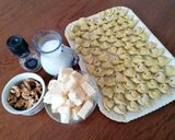 Foto del passaggio 5 della ricetta TORTELLINI ALL'ODORE DI RUCOLA RIPIENI DI ZUCCA CON MONTASIO E NOCI