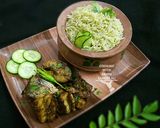 A picture of step 7 of Thai green rice with fried fish.
