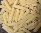A picture of step 3 of Red sauce cheesy pasta.