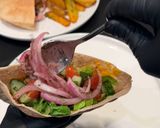 A picture of step 4 of Chicken Shawarma Pita Pockets.