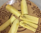 A picture of step 3 of Pazham pori (banana fritters).