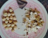 A picture of step 2 of Chocolate coated Hazelnut filled coconut laddu.