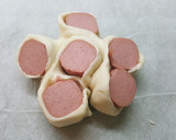 Foto del paso 7 de la receta: Bollo de hojaldre con frankfurt y queso