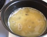 A picture of step 4 of Garlic butter rice with raisins.