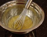 A picture of step 6 of Blueberry Strusel Muffins with a White Chocolaye Drizzle.