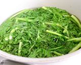A picture of step 1 of Boiled Chrysanthemum Greens & Eggs Mashed with Fish Sauce.