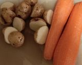 A picture of step 1 of Maple garlic chicken with crispy potatoes and steamed carrots.