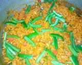 A picture of step 12 of Egg and parsley fried rice.