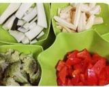 A picture of step 1 of Broccoli BABY CORN ZUCCHINI IN RED CAPSICUM (Bellpeppers)GRAVY.