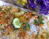 A picture of step 15 of ChatpatiBombay biryani with tang twist, yogurt salad, mango, apple cubes.