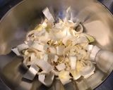 A picture of step 2 of Endive Salad with Cucumber and Red Onion in Chive Dressing.