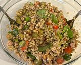 A picture of step 4 of Farro Salad with Pesto, Iceberg Lettuce, Basil, Green Olives, Tomatoes, and Tuna.