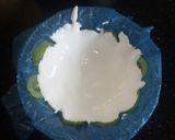 A picture of step 5 of Lemon cake pudding with upside down kiwi whipped cream frosting.